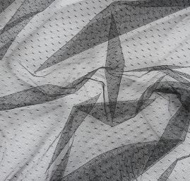 Efektní tyl s vyšitými punítky v černé barvě