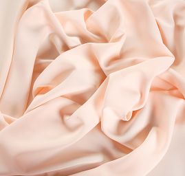 Kostýmová letní látka pastel meruňková