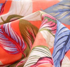 Viskozová šatová látka listy světle oranžová