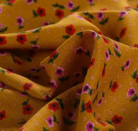 Viskozová šatová látka drobné květy okrová