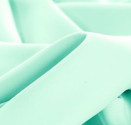 Kostýmová letní látka pastel pistáciová