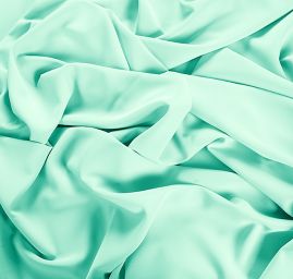 Kostýmová letní látka pastel pistáciová