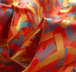 Brokát geometrický motiv červený