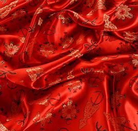 Látka brokát orientální motiv červená