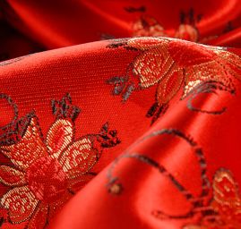 Látka brokát orientální motiv červená