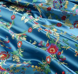 Brokát s folklórním motivem květů modrý
