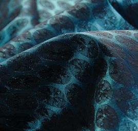 Brokát pružný geometrický ornament tyrkysový