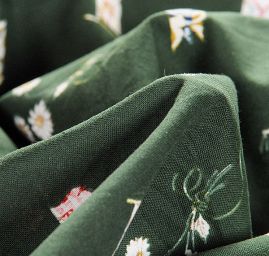 Bavlněná látka vzor praporky/květy zelená