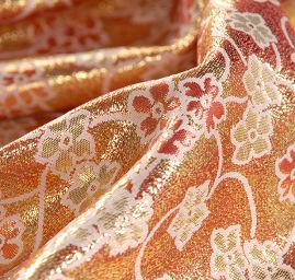 Brokát lamé paisley květinový motiv růžovozlatý 
