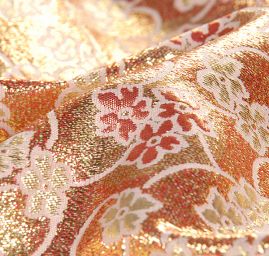 Brokát lamé paisley květinový motiv růžovozlatý 