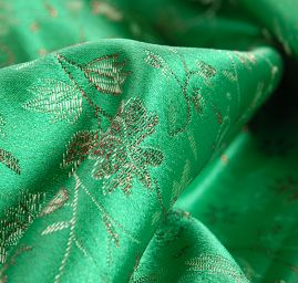 Brokát jemný květinový motiv zelený II.jakost