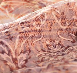 Efektní látka s plastickým vzorem hlavic