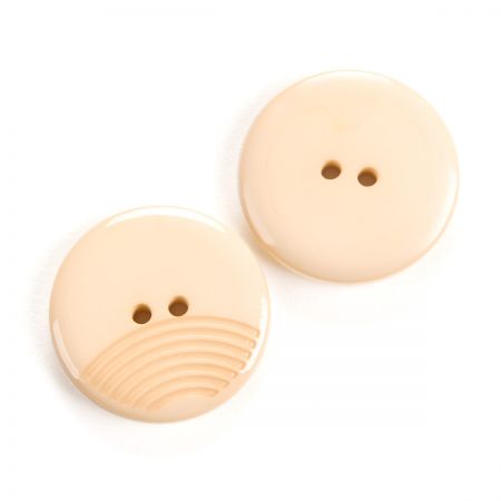 Knoflík plastový kulatý krémový 44"