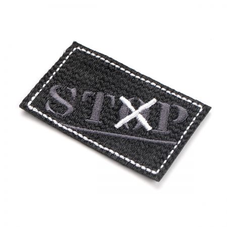 Nažehlovačka stop šedočerná