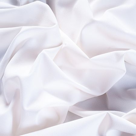 Kostýmová krepová látka v barvě slonvé kosti