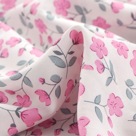 Viskozová šatová látka drobné květy pastel růžová