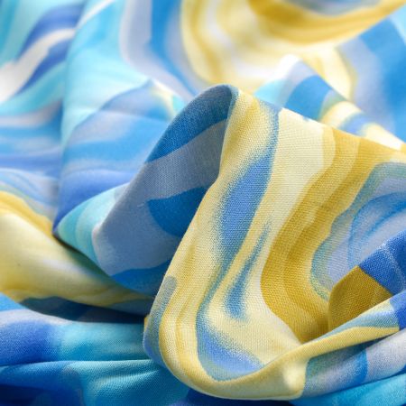 Viskozová šatová látka motiv tahy štětcem modrá