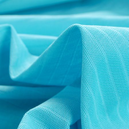 Pletenina s plastickým vzorem pruhů tyrkysová