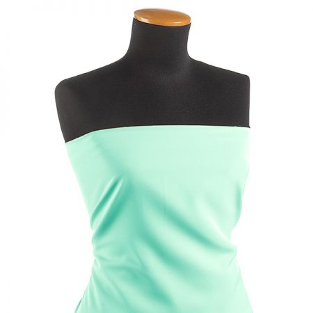 Kostýmová letní látka pastel pistáciová