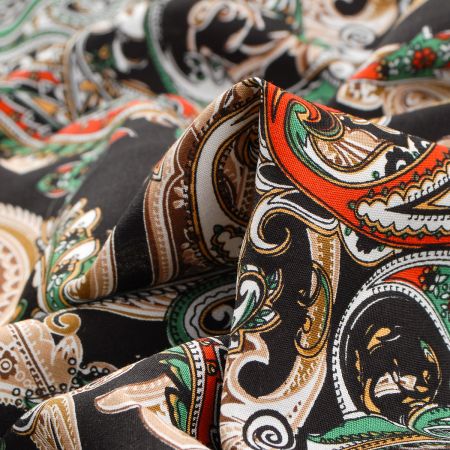 Viskozová šatová látka paisley vzor černá oranžová