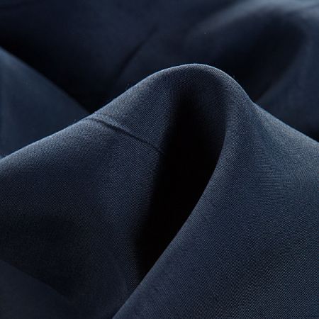 Viskozová šatová látka temně modrá