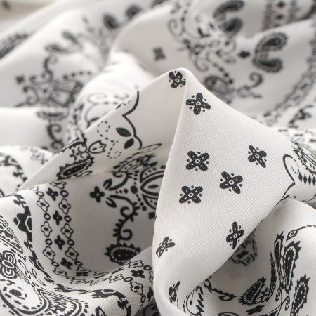 Viskozová šatová látka paisley vzor černá/bílá