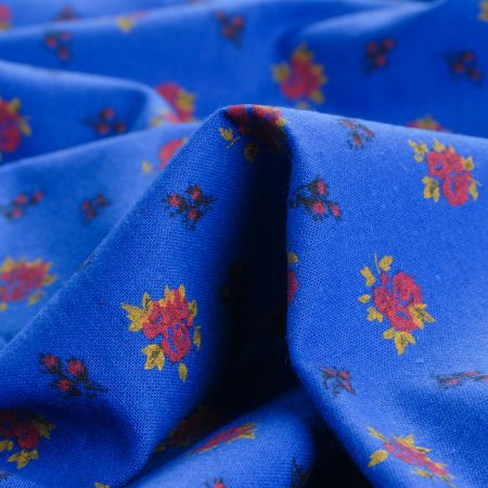 Bavlněná látka drobné květy modrá