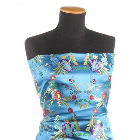 Brokát s folklórním motivem květů modrý