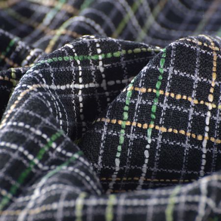 Látka na kostým imitující ručně tkané metráže černozelená