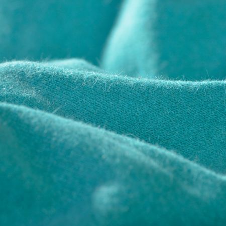 Vlněný hladký úplet s angorovým vlasem tyrkysové barvy II.jakost