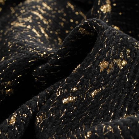 Kostýmová látka plastický vzor černozlaté barvy